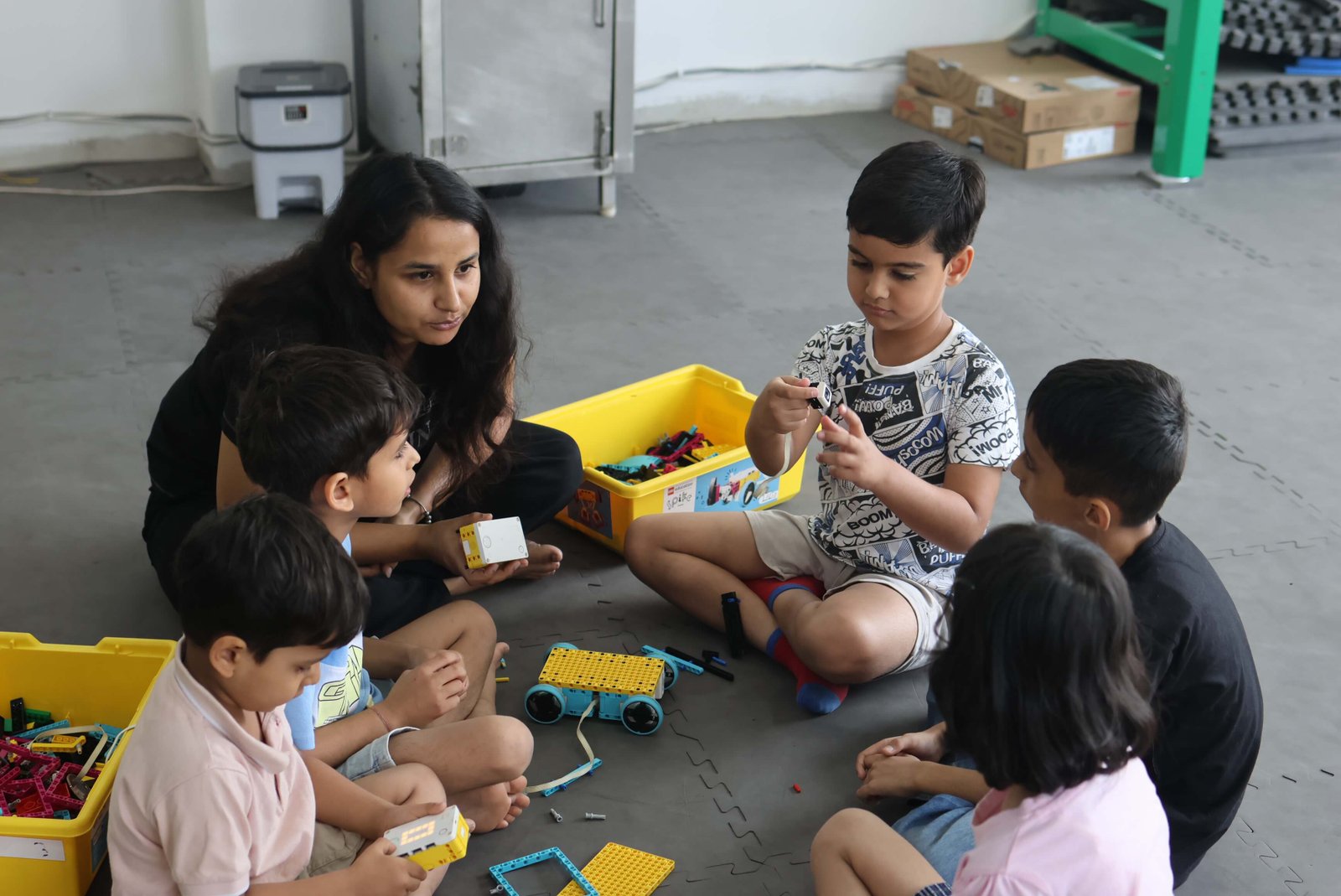 Children of different ages working on robotics projects at MittyVerse Gurugram